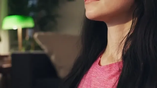 Close profile of a person breathing calmly through the nose, with the jawline and throat visible